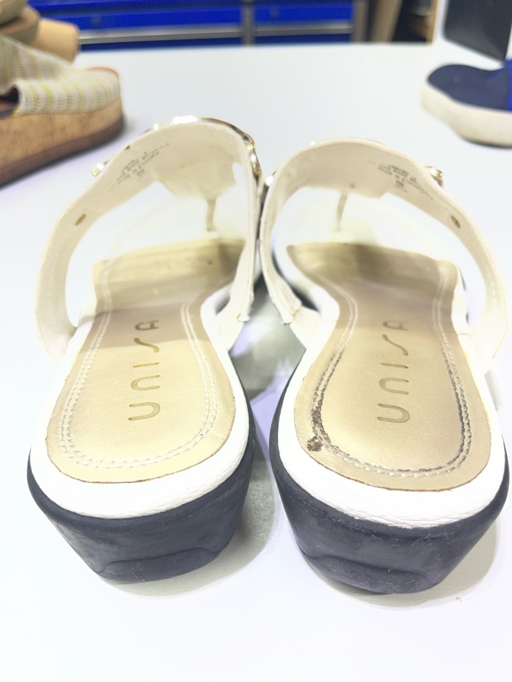 Unisa brand white mules featuring a gold-tone metal detail. - Picture 5 of 6
